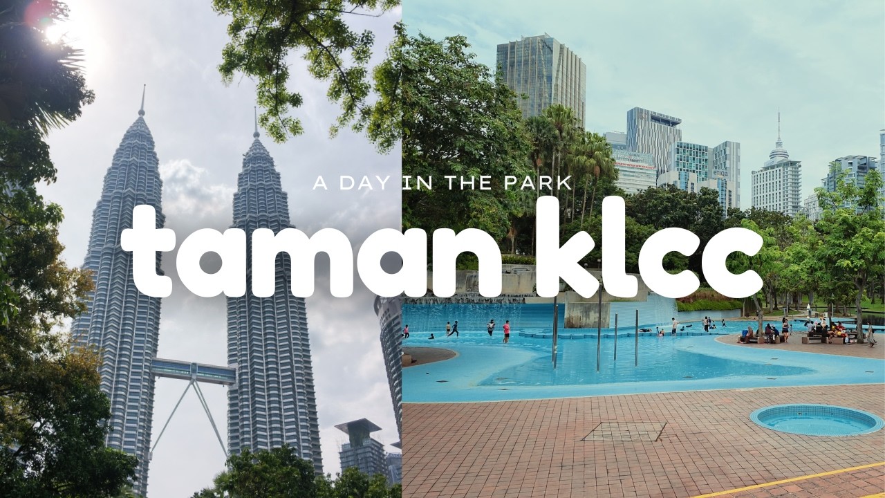 The Petronas Towers framed by trees and the blue wading pool in Taman KLCC.